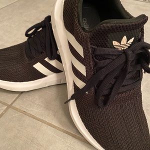 Black and white adidas runners